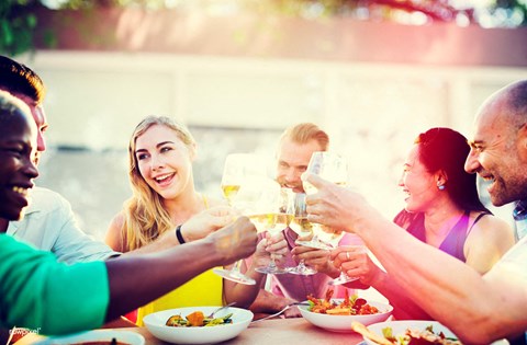 group of friends drinking and laughing